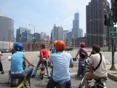 Riding mopeds towards downtown